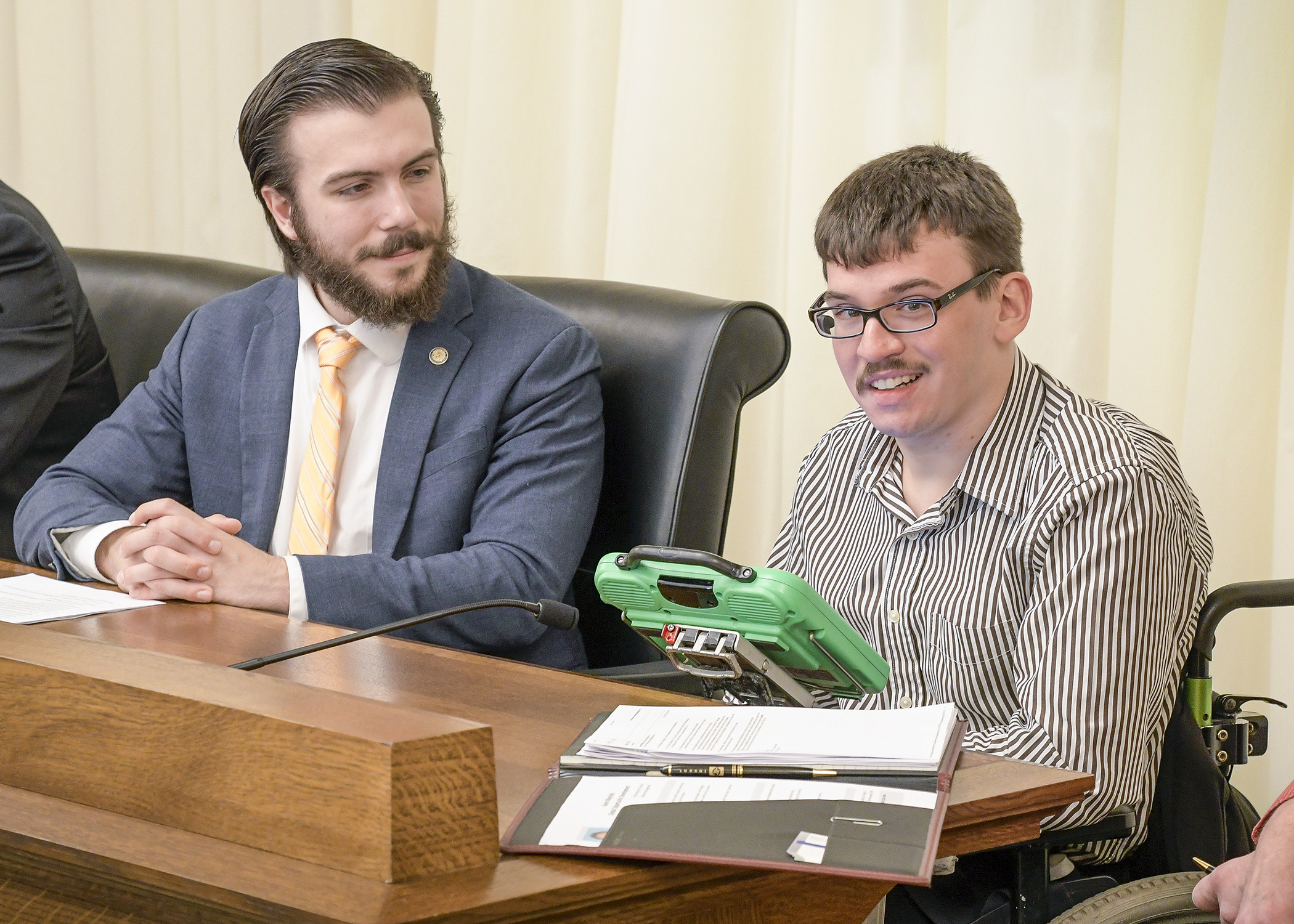 Erik Marschel testifies before the House Health and Human Services Policy Committee Feb. 28 in support of a bill sponsored by Rep. Hunter Cantrell, left, that would provide vocational services for individuals with disabilities. Photo by Andrew VonBank